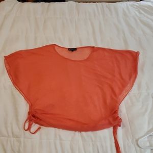 Coral colored sleeveless lightweight blouse